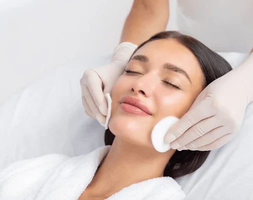 female-beautician-cleansing-skin-young-600nw-2496076153