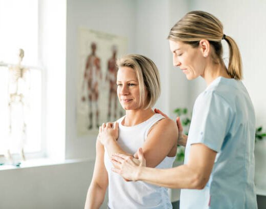 Modern rehabilitation physiotherapy worker with woman client