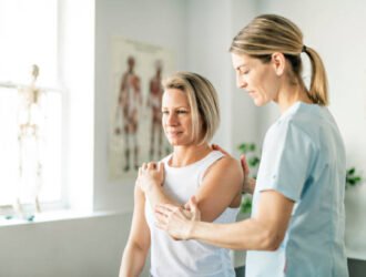 Modern rehabilitation physiotherapy worker with woman client