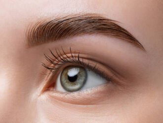 The make-up artist does Long-lasting styling of the eyebrows of the eyebrows and will color the eyebrows. Eyebrow lamination. Professional make-up and face care.
