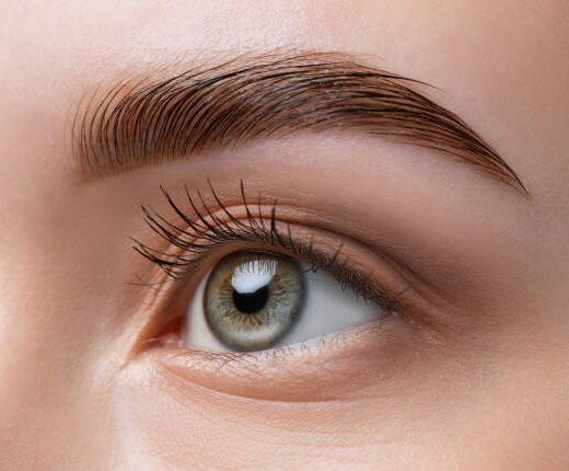 istockphoto-1411222393-612x612 The make-up artist does Long-lasting styling of the eyebrows of the eyebrows and will color the eyebrows. Eyebrow lamination. Professional make-up and face care.