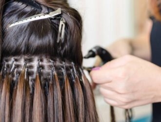 Female hand upgrading hair in the salon