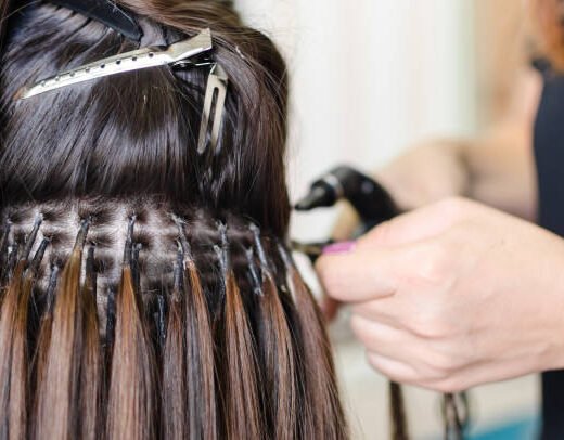 Female hand upgrading hair in the salon Female hand upgrading hair in the salon